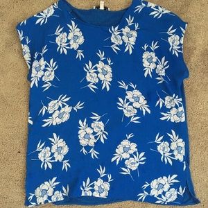 Blue shirt with white flower pattern